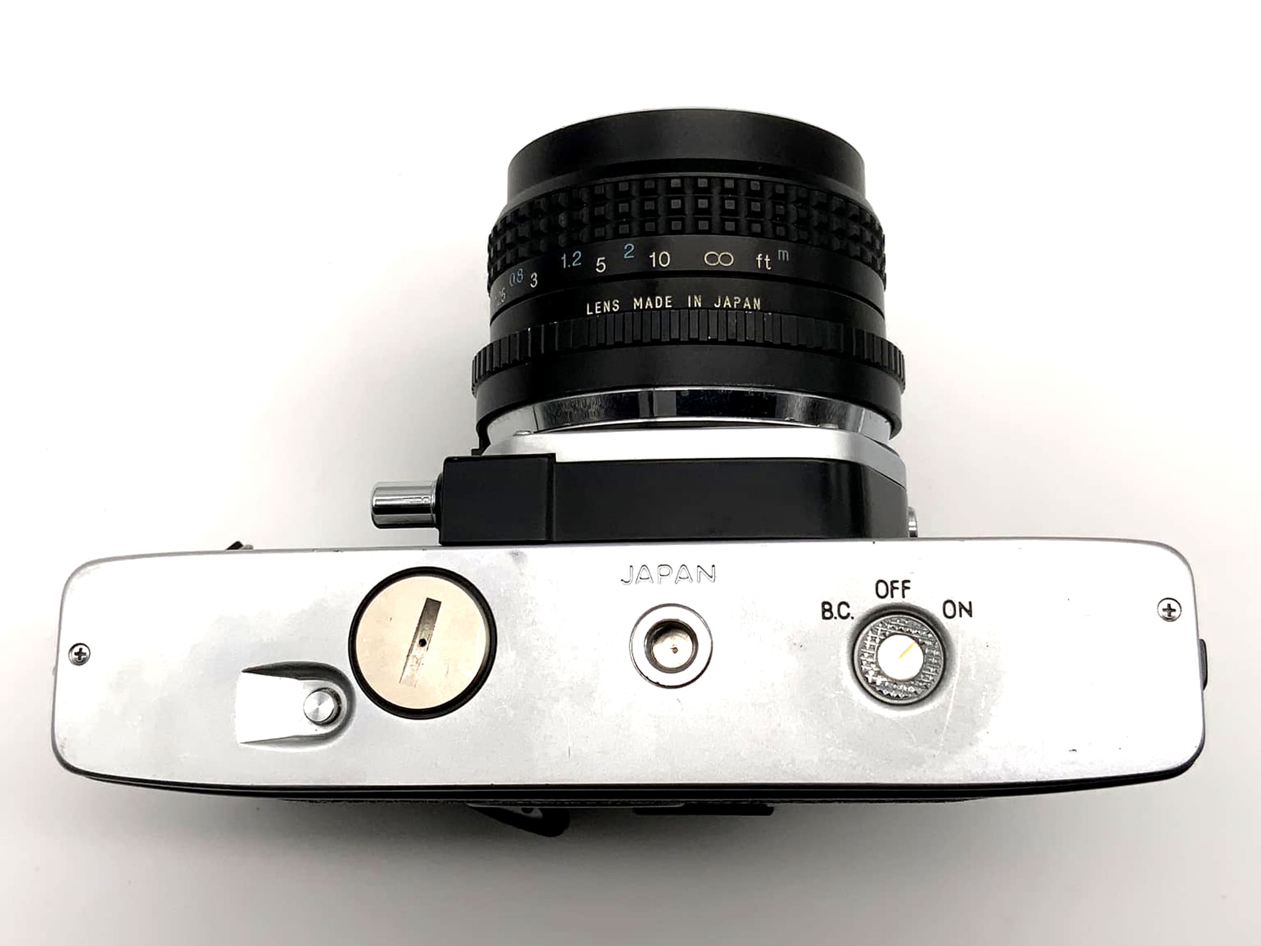 Minolta SRT 100x mit Tokina RMC 2.8 28mm Spiegelreflexkamera 35mm analog