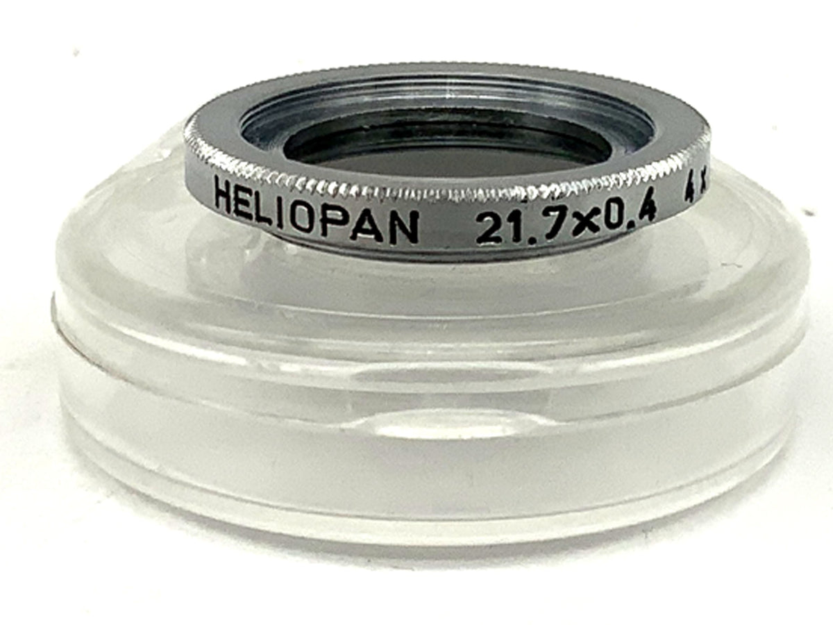Filtre gris Heliopan 21,7 x 0,4, gris moyen/clair, grossissement 4x -2, dans son emballage d'origine, diamètre 21,7 mm.